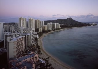 image of the sun setting in Honolulu. Farewell tours on Oahu are a great way to spend a final day on the island.